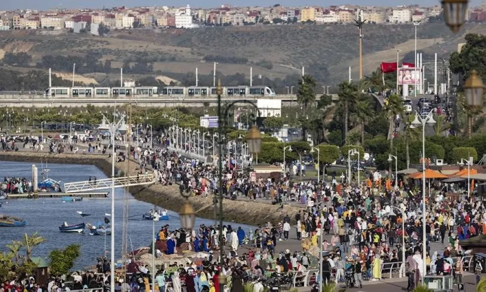 Moroccans gather on the coast a day after Eid al-Fitr, which marks the end of Islamic holy fasting month of Ramada, in the capital Rabat on May 14, 2021. (Photo by FADEL SENNA / AFP)