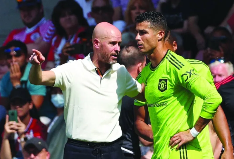 In this file photo taken on August 27, 2022, Manchester United’s Dutch manager Erik ten Hag (left) directs substitute Manchester United’s Portuguese striker Cristiano Ronaldo during the Premier League match against Southampton at the St Mary’s Stadium in Southampton, England. (AFP) 