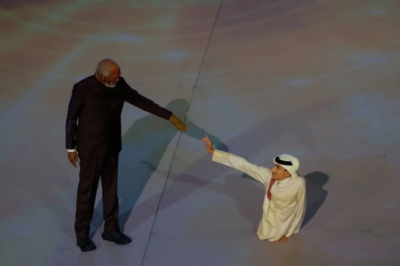 Ghanim al-Muftah with Morgan Freeman during the opening ceremony yesterday.