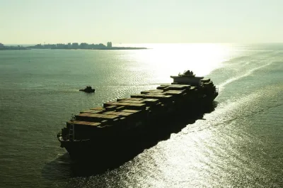 A container ship sails into New York Harbor (file). Global GDP is set to grow 3.1% this year — nearly half the rate for last year, the Organisation for Economic Co-operation and Development said.