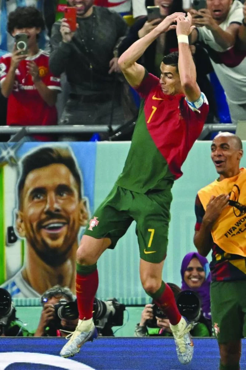 Portugal’s forward Cristiano Ronaldo celebrates after scoring from the penalty spot during the World Cup Group H match against Ghana at Stadium 974. (AFP)