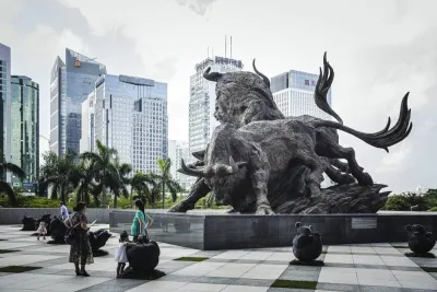 People stand in front of a sculpture of bulls at the entrance to the Shenzhen Stock Exchange building in China. Investors who jumped into Chinese stocks on November 11 when Beijing cut Covid-19 quarantine periods and dialled back testing have shared in a rally that’s added almost 70bn to the value of equities in the MSCI China Index.