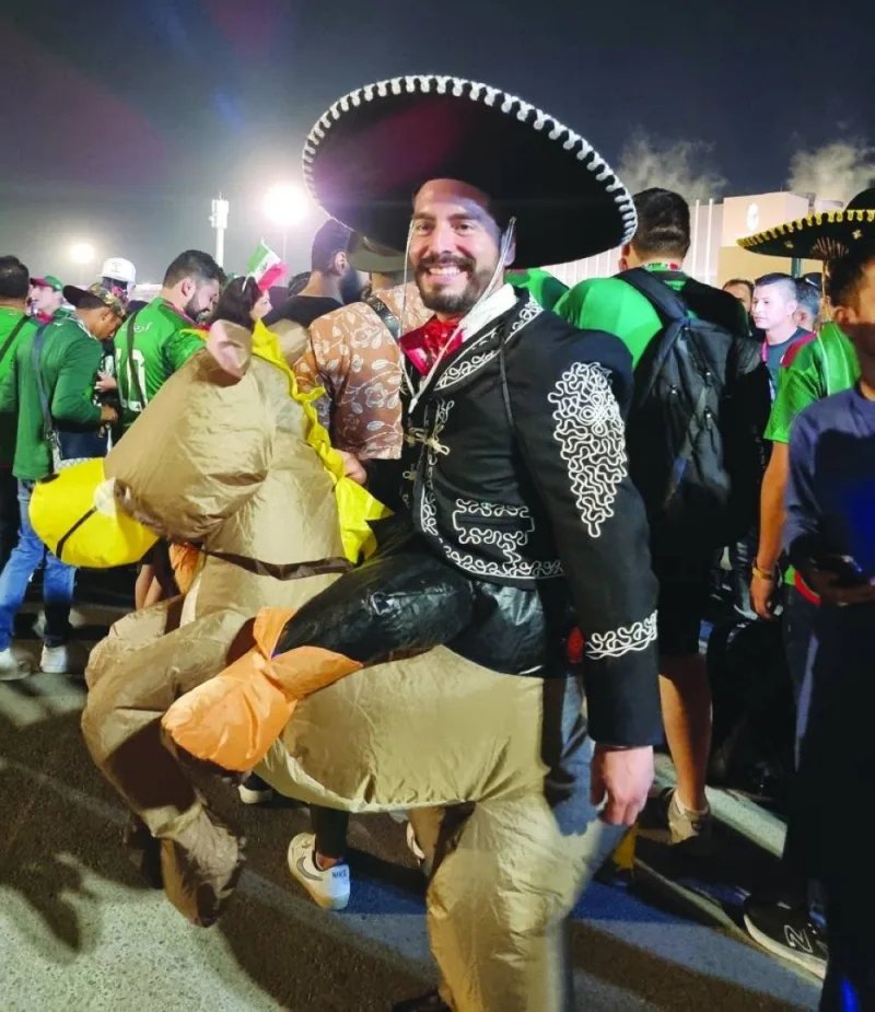 A Mexican supporter joins the football frenzy in Qatar.
