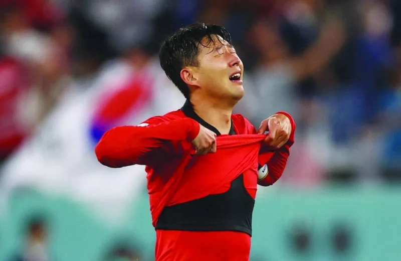South Korea’s Son Heung-min celebrates after winning their Group H match against Portugal yesterday. (Reuters)