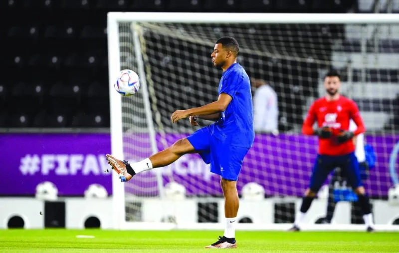 France's forward Kylian Mbappe controls the ball during a training session at the Al Sadd SC training center in Doha yesterday. (AFP)