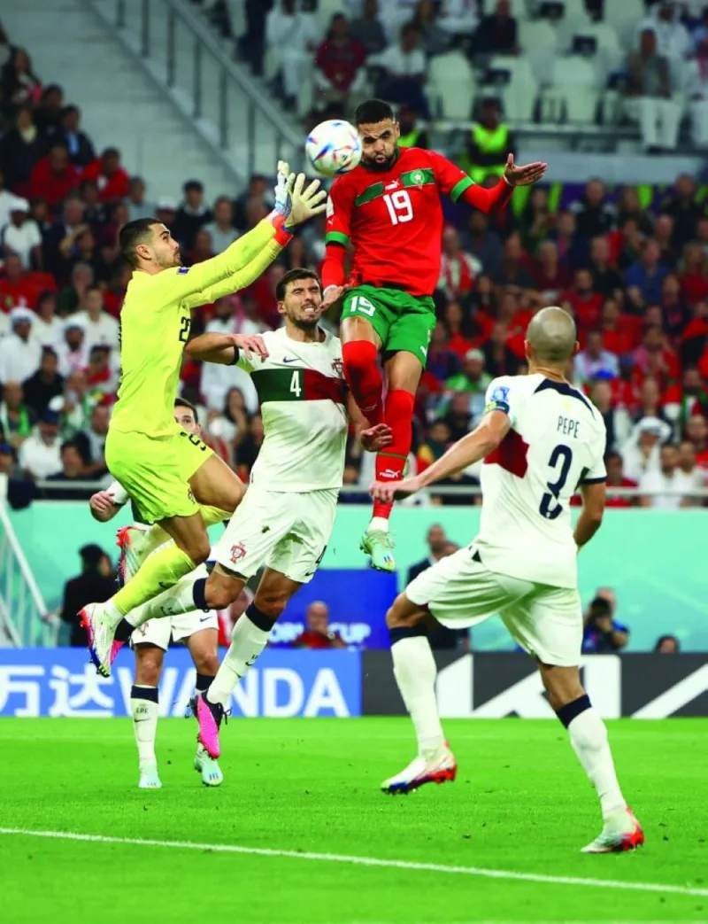 Morocco’s Youssef En-Nesyri soars above Portugal defenders yesterday. (Reuters)
