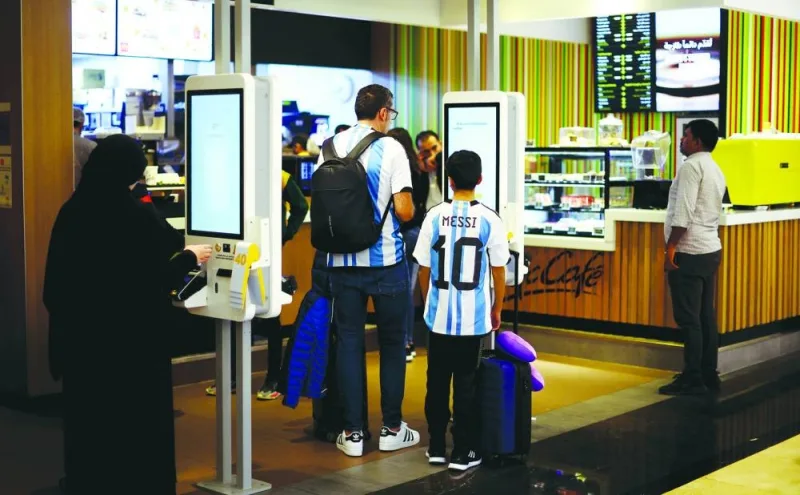 An Argentina fan with Lionel Messi’s name and number on the back of his shirt is seen in Doha. (Reuters)
