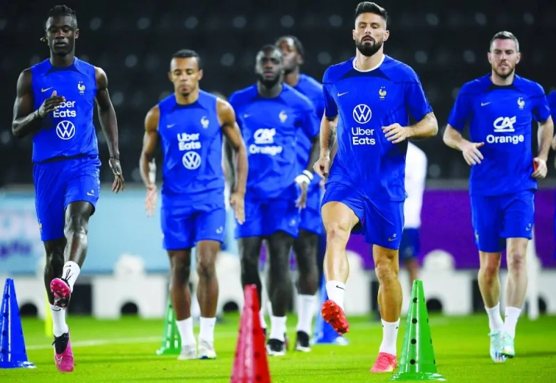 From left: France’s Eduardo Camavinga, Jules Kounde, Dayot Upamecano, Olivier Giroud and Jordan Veretout attend a training session at the Al Sadd SC training centre in Doha yesterday. (AFP)