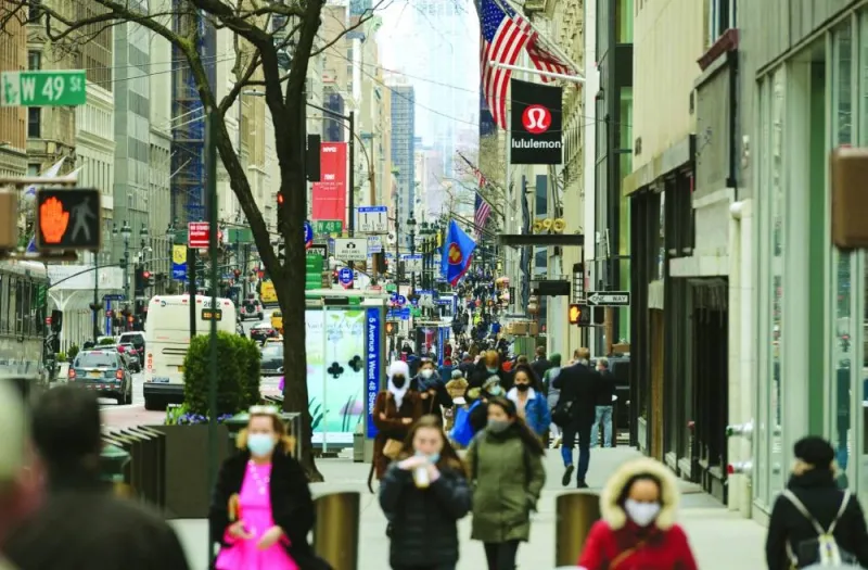 People walk on a busy 5th Avenue in midtown Manhattan. American consumers will end the year with about 10bn more in credit-card debt than they started with, which would be close to an annual record, according to an online personal finance data firm.