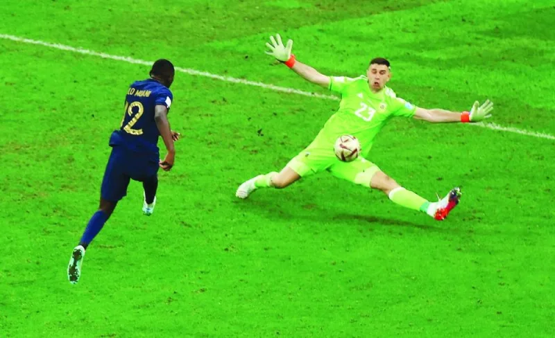 Argentina’s Emiliano Martinez saves a shot from France’s Randal Kolo Muani during the World Cup final at the Lusail Stadium on Sunday. (Reuters)