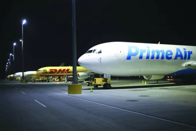 An Amazon.com Prime Air cargo jet sits parked at the DHL Worldwide Express hub of Cincinnati/Northern Kentucky International Airport in Hebron. Amazon is trying to sell excess space on its cargo planes, its latest effort to adjust from a rapid pandemic-era expansion to a slowdown in online growth.
