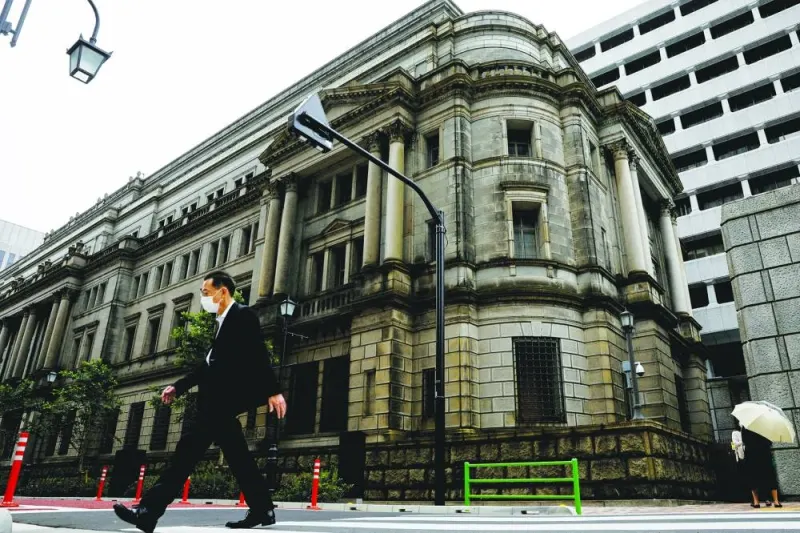 A man walks past the headquarters of Bank of Japan in Tokyo. The yen looks to be losing its appeal as the currency of choice to fund so-called carry trades, with speculators cutting bearish bets on it to the lowest level in nearly four months in the wake of this week’s shock move by the BoJ.