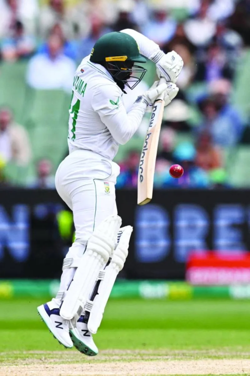 South African batsman Temba Bavuma fends off a delivery on the fourth day of the second Test against Australia at the MCG in Melbourne on Thursday. (AFP) 