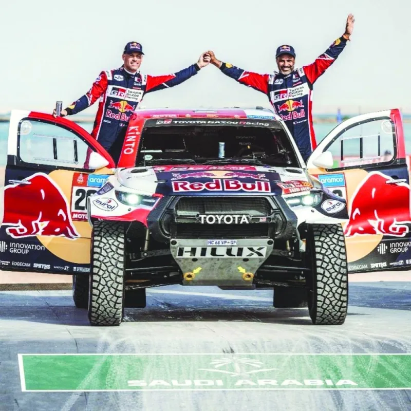 Nasser al-Attiyah and his co-driver Mathieu Baumel (left) of France at the ceremonial start of the Dakar Rally.