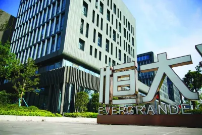 An Evergrande sign is seen at the Evergrande Automotive R&D Institute Headquarters of China Evergrande Group in Shanghai. The world’s most indebted developer has yet to announce its offshore debt-restructuring plans, falling short on its promise to do so by the end of 2022.