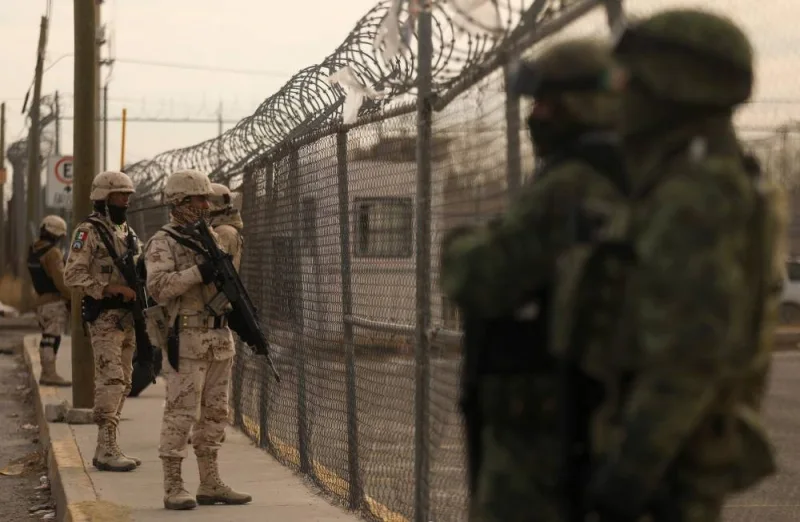Members of the Mexican Army secure an area outside the prison of Ciudad Juarez number 3 after an attack in Ciudad Juarez, Chihuahua state, on January 1, 2023. (AFP)