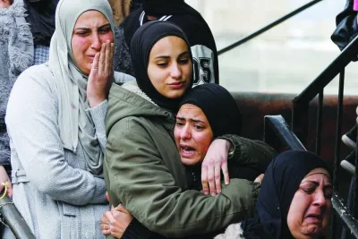 Relatives mourn during the funeral of Palestinian Fouad Abed who was killed in an Israeli raid, in Kafr-Dan village in the occupied West Bank, yesterday.