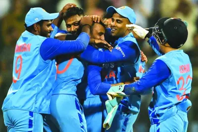India’s players celebrate their win at the end of the first Twenty20 international against Sri Lanka at the Wankhede Stadium in Mumbai yesterday. (AFP)