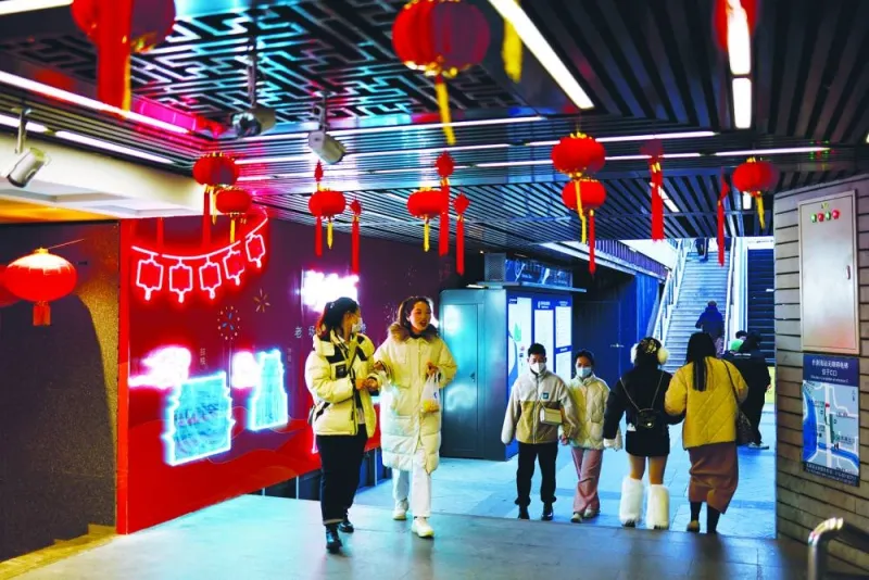 People walk past an underground area decorated with lanterns for Chinese Lunar New Year, amid the coronavirus disease (Covid-19) outbreak in Beijing.
