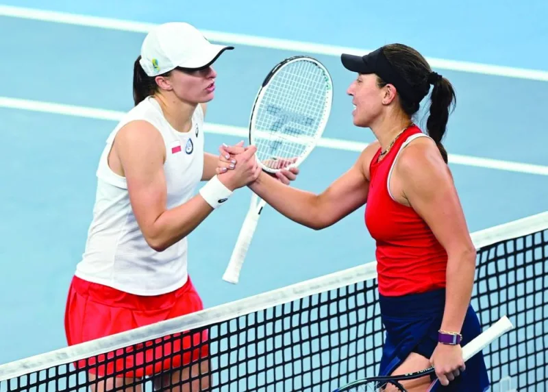 Jessica Pegula of the US is seen shaking hands with Poland’s Iga Swiatek after their United Cup match at Sydney Olympic Park in Sydney yesterday. (Rueters)