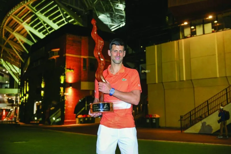 Serbian tennis player Novak Djokovic poses with the winners trophy after the final of the ATP Adelaide International against Sebastian Korda of the US in Adelaide yesterday. (AFP)