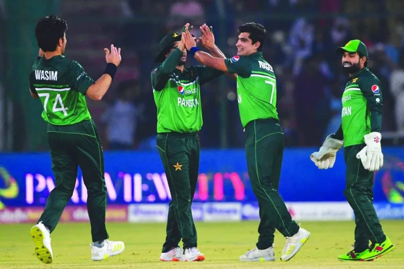 Pakistan's Naseem Shah (second right) celebrates with teammates after taking the wicket of New Zealand's Henry Shipley (not pictured) during the first one-day international (ODI) at the National Stadium in Karachi yesterday. (AFP)