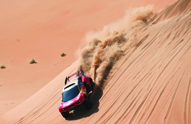 French driver Sebastien Loeb and Belgian co-driver Fabian Lurquin steer their BRX during the stage ten of the Dakar Rally between Haradh and Shaybah in Saudi Arabia yesterday. (AFP)