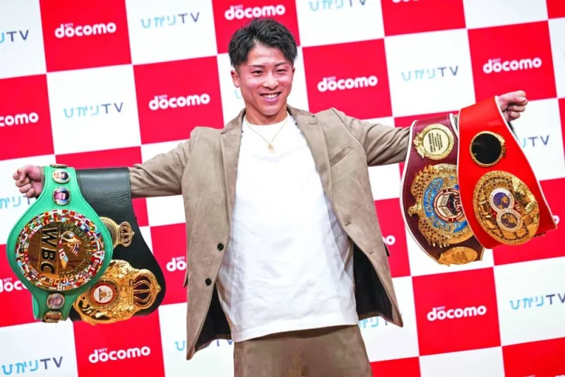 Boxer Naoya Inoue poses for photographs during a press conference in Yokohama yesterday. (AFP)