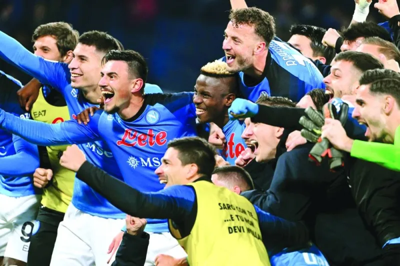 Napoli's players celebrate after winning the Italian Serie A football match between Napoli and Juventus at the Diego-Maradona stadium in Naples on January 13, 2023. (Photo by Alberto PIZZOLI / AFP)