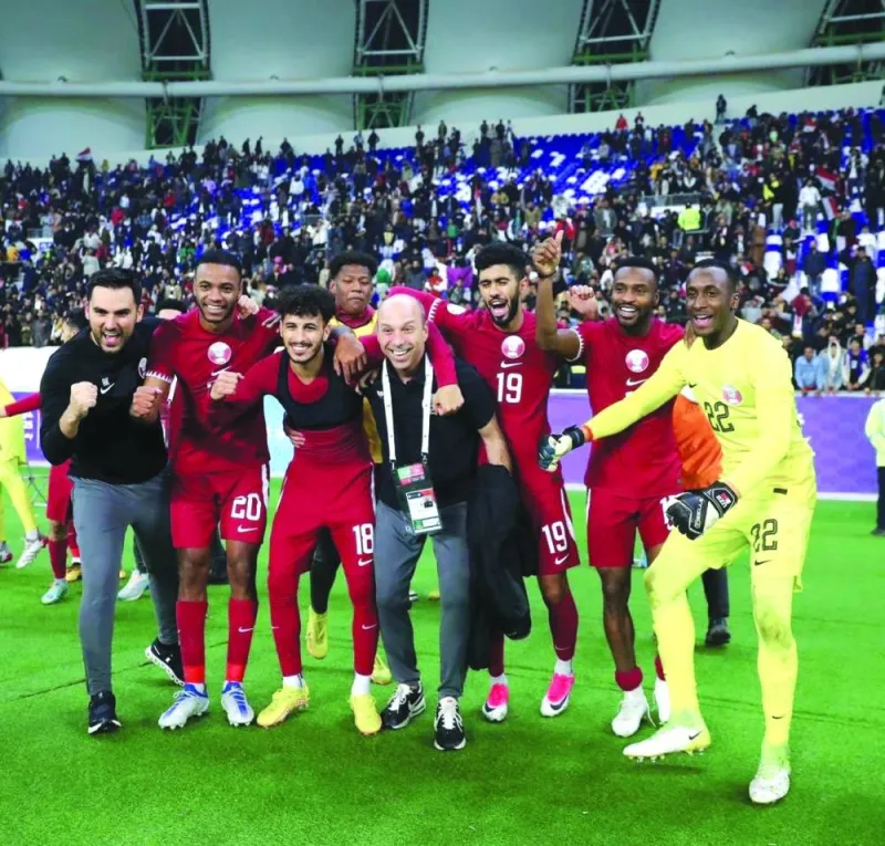 Qatar coach Bruno Pinheiro celebrates with players after the win over the UAE in the Arabian Gulf Cup in Basra, Iraq, on Friday.  
