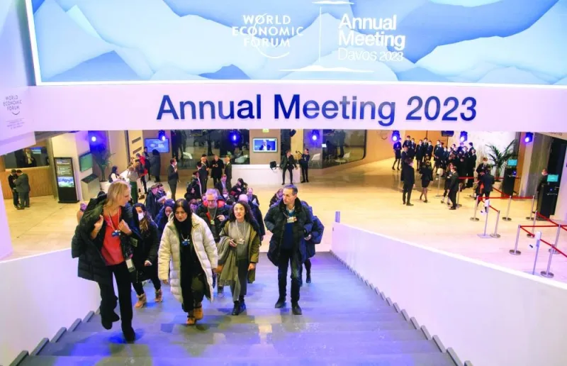 Participants of the World Economic Forum 2023 are seen in a hall at Davos Congress Centre in Switzerland. Two-thirds of private and public sector chief economists surveyed by the WEF expect a global recession in 2023, the Davos-organiser said yesterday as business and government leaders gathered for its annual meeting.