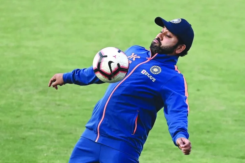 India’s cricket captain Rohit Sharma is seen playing football during a practice session at the Rajiv Gandhi International Cricket Stadium in Hyderabad ahead of their first ODI against New Zealand. (AFP)
