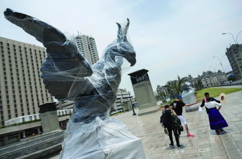 View of a monument in Lima wrapped in plastic to prevent paint damage during the upcoming protest against the government of President Dina Boluarte.