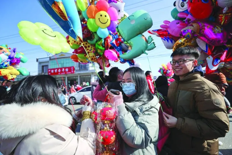 People visit a market in Lianyungang, in China’s eastern Jiangsu province.