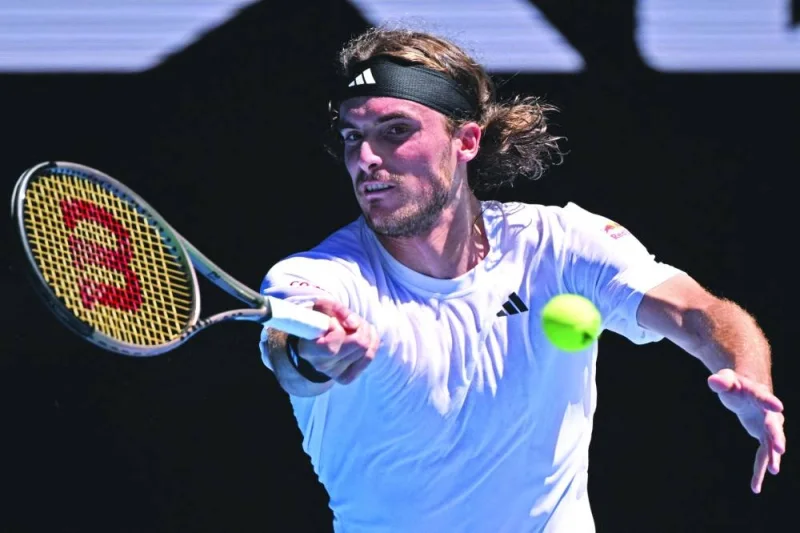 Greece&#039;s Stefanos Tsitsipas hits a return against Netherlands&#039; Tallon Griekspoor during their men&#039;s singles match on day five of the Australian Open tennis tournament in Melbourne on Friday. (AFP)