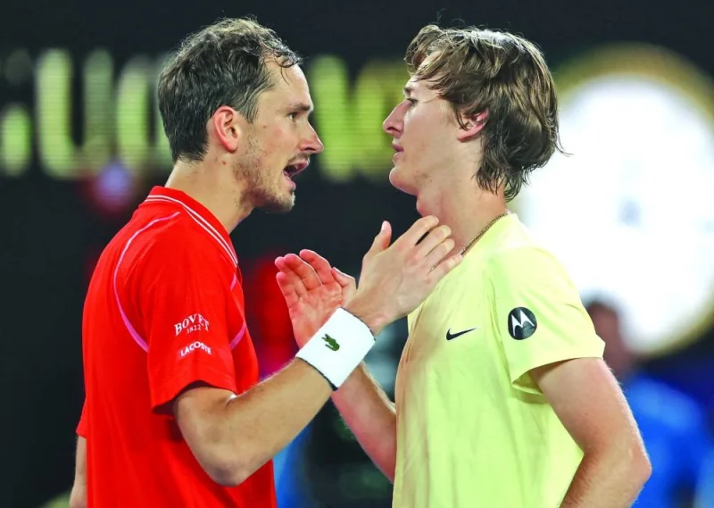 Sebastian Korda of the US shakes hands with Russia&#039;s Daniil Medvedev after winning his third round match at Melbourne Park, Melbourne, Australia, on Friday. (Reuters)