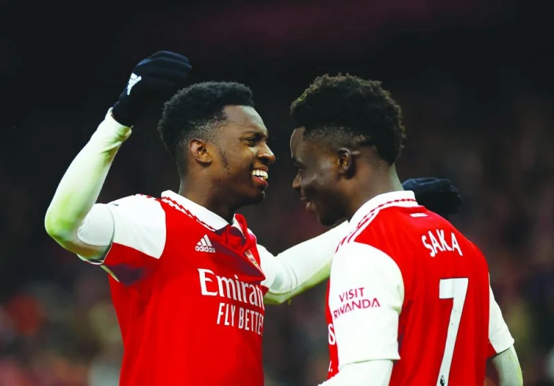 Arsenal's Eddie Nketiah celebrates with teammate Bukayo Saka after scoring their third goal against Manchester United in London yesterday. (Reuters)