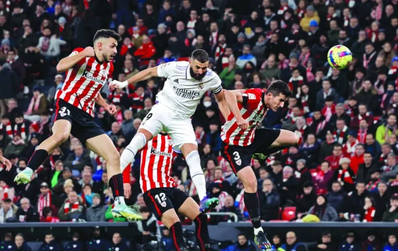 Real Madrid’s Karim Benzema (centre) goes for the header with Athletic Bilbao’s Dani Vivian (left) and Aitor Paredes during the La Liga match in Bilbao, Spain, on Sunday. (Reuters)