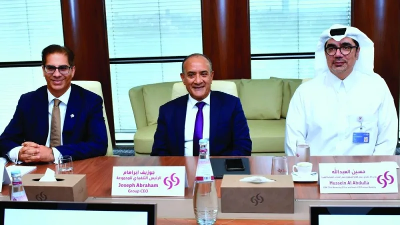Commercial Bank Group CEO Joseph Abraham (centre) with Rehan Khan, chief financial officer and Hussein al-Abdulla, chief marketing officer at the media roundtable at the Commercial Bank Plaza Tuesday. PICTURE: Thajudheen