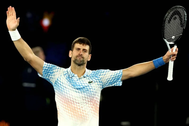 TOPSHOT - Serbia&#039;s Novak Djokovic celebrates victory against Russia&#039;s Andrey Rublev during their men&#039;s singles quarter-final match on day ten of the Australian Open tennis tournament in Melbourne on January 25, 2023. (AFP)