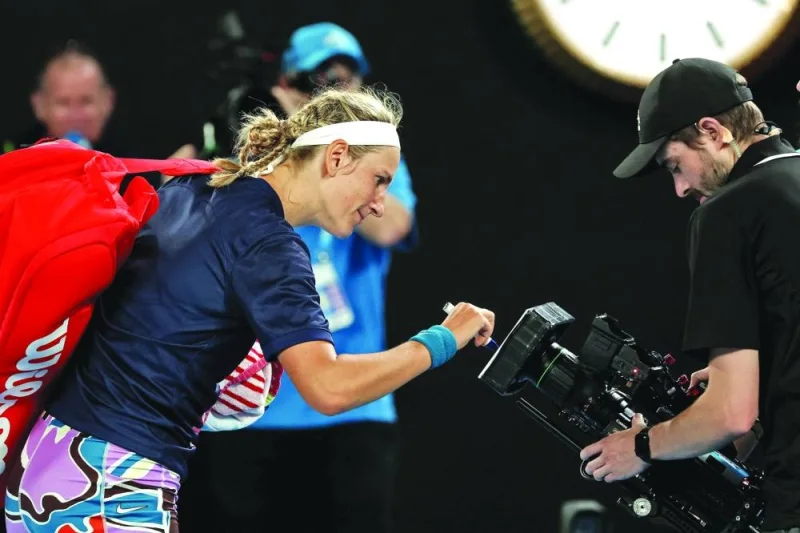 Belarus&#039; Victoria Azarenka signs on the camera after the singles quarter-final match against Jessica Pegula of the US on day nine of the Australian Open in Melbourne on Tuesday. (AFP)