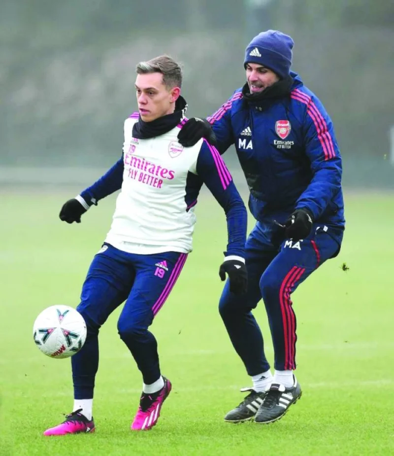Arsenal coach Mikel Arteta (right) and midfielder Leandro Trossard during a training session at London Colney.