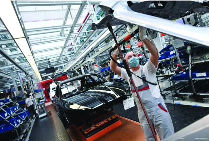 An employee works at the A3 and A4 production line of the German car manufacturer Audi in Ingolstadt, Germany. (Reuters)