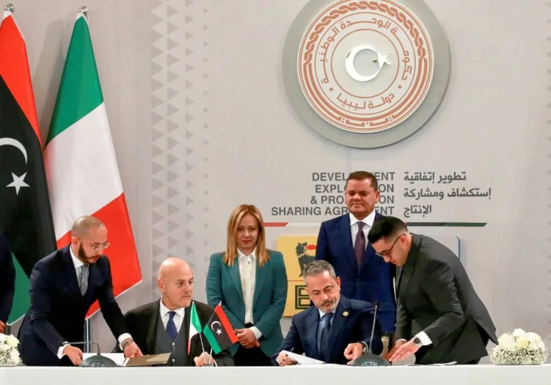 Eni CEO Claudio Descalzi and National Oil Corporation (NOC) head Farhat Bengdara attend the signing of an agreement between the two companies as Italian Prime Minister Giorgia Meloni and head of Libya's Government of National Unity Abdulhamid al-Dbeibah stand by, in Tripoli, Libya, yesterday.