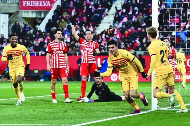 Barcelona’s Spanish midfielder Pedri (second right) celebrates after scoring against Girona in the La Liga on Saturday. (AFP)