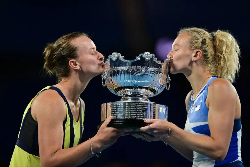 Czech Republic&#039;s Barbora Krejcikova (L) and Katerina Siniakova celebrates with the winner&#039;s trophy after the women&#039;s doubles final match against Japan&#039;s Shuko Aoyama and Ena Shibahara on day fourteen of the Australian Open tennis tournament in Melbourne on January 29, 2023. (AFP)