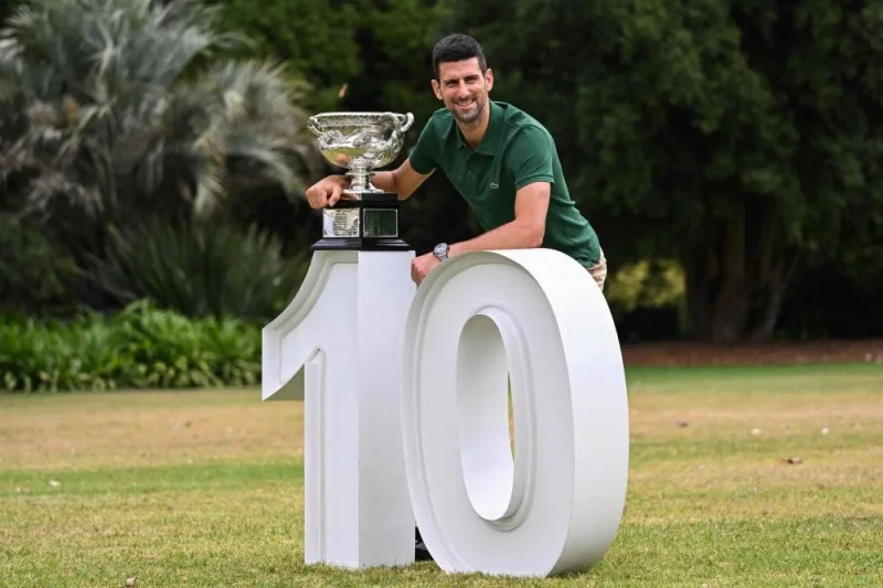 Serbia&#039;s Novak Djokovic celebrates with the Norman Brookes Challenge Cup trophy a day after his victory against Greece&#039;s Stefanos Tsitsipas in the men&#039;s singles final match of the Australian Open tennis tournament in Melbourne. (AFP)