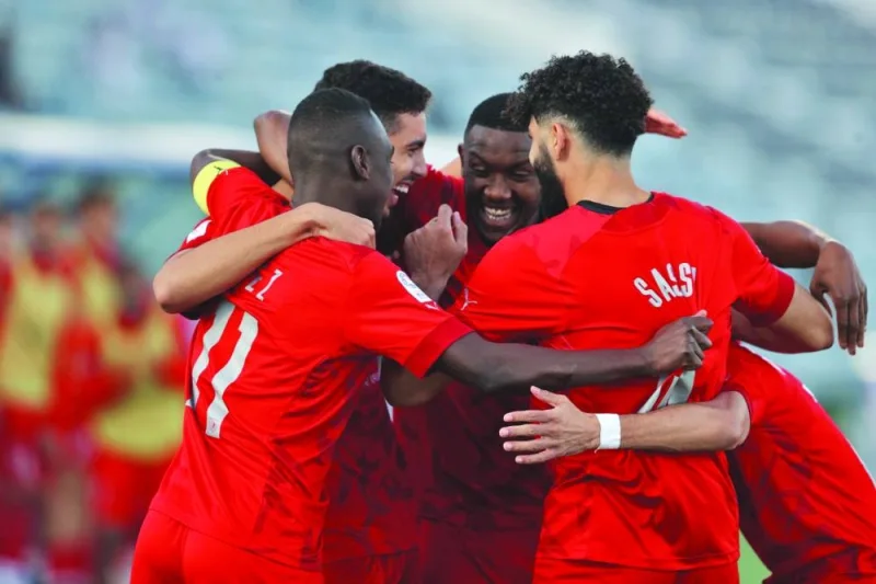 Al Duhail’s defender Yousef Ayman (second left) celebrates with teammates after scoring against Al Wakrah during the QNB Stars League on Monday.