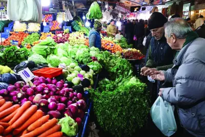 A vendor sells goods at a vegetable and fruit market in the historic Ulus district in Ankara. Inflation has been stoked by a currency crisis at the end of 2021 and it touched a 24-year peak of 85.51% in October.