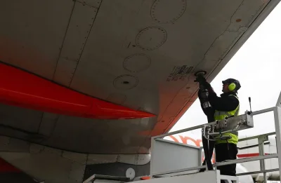 A member of the ground crew connects a fuel hose to the wing of an Airbus Group aircraft, operated by EasyJet, during the refuelling process between flights at the north terminal of London Gatwick airport. China’s lifting of Covid-19 travel restrictions and US refinery outages are expected to have an impact on jet fuel price this year, which have recently risen to levels not recorded before.